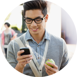 image of an example of a smiling patient on his phone